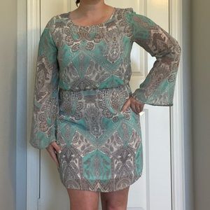 Long sleeve teal, white and gold dress